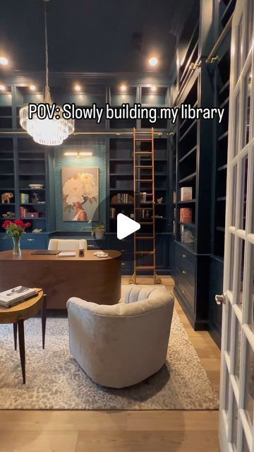 a living room filled with furniture and bookshelves