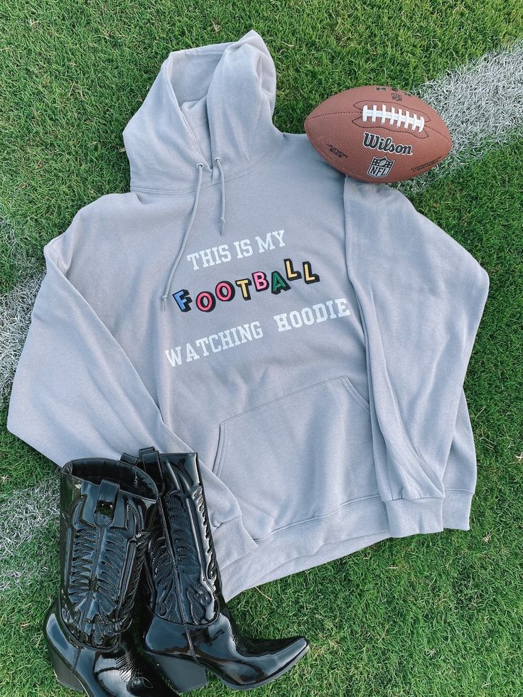 ☆A twist on our classic "hangover hoodie" that everyone loves! How cute is this football watching hoodie? Featuring our colorful patch lettering. Cotton Blend Gray Hoodie Materials may have natural variations Colors may vary from different viewing devices Model wearing a size XL Comes Regular Length ☆For a cropped, distressed, or acid washed look add customizations to the notes section at checkout. ☆Please note: This item is a handmade item and no two items will be perfectly alike ☆PROCESSING & SHIPPING: Estimated Time- Products can take up to 2-6+ business weeks to be made before being dispatched. Once dispatched the time your crewneck takes to reach you will depend where you are located and what shipping method you choose at checkout. ☆Return Policy: We do not accept returns or exchanges Fall Sports Fan Hoodie With Letter Print, Sports Fan Letter Print Hoodie For Fall, Game Day Hoodie With Letter Print, Hooded Hoodie For Football Season Streetwear, Football Season Hoodie With Letter Print For Sports Events, Casual Football Season Hoodie With Letter Print, Casual Letter Print Hoodie For Football Season, Football Season Hoodie With Letter Print For Game Day, Game Day Hoodie With Letter Print For Football Season