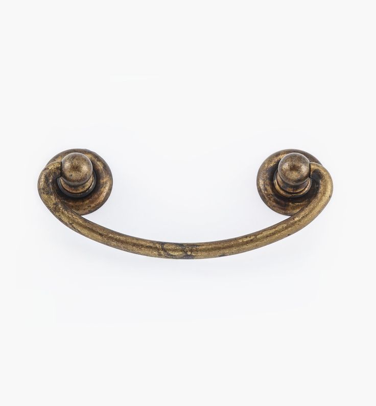 an old brass door handle on a white background