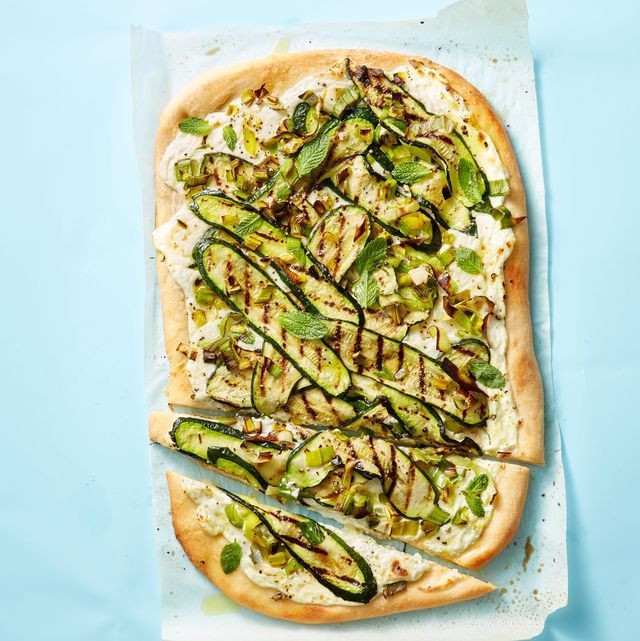 a flat bread pizza with zucchini and cheese