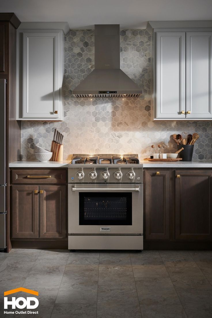 a stove top oven sitting inside of a kitchen next to wooden cabinets and counter tops