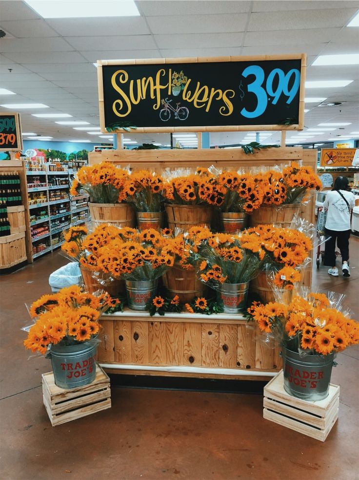 the sunflowers are on display at the store