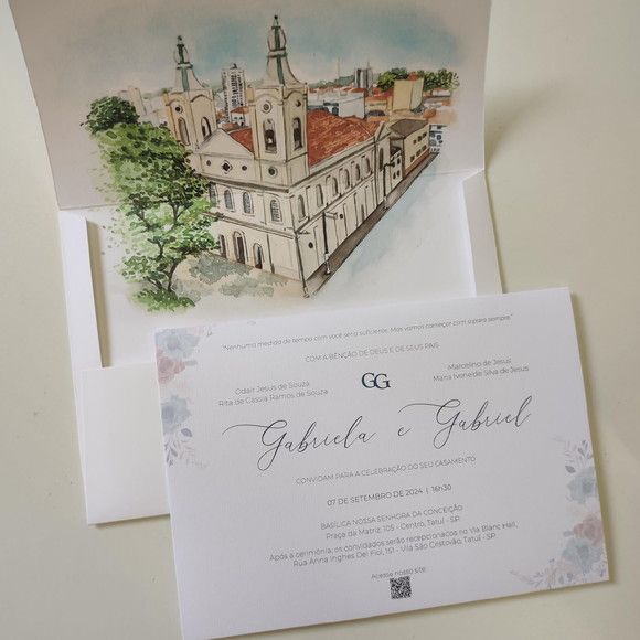 the wedding stationery is laid out on top of each other, with an illustration of a church