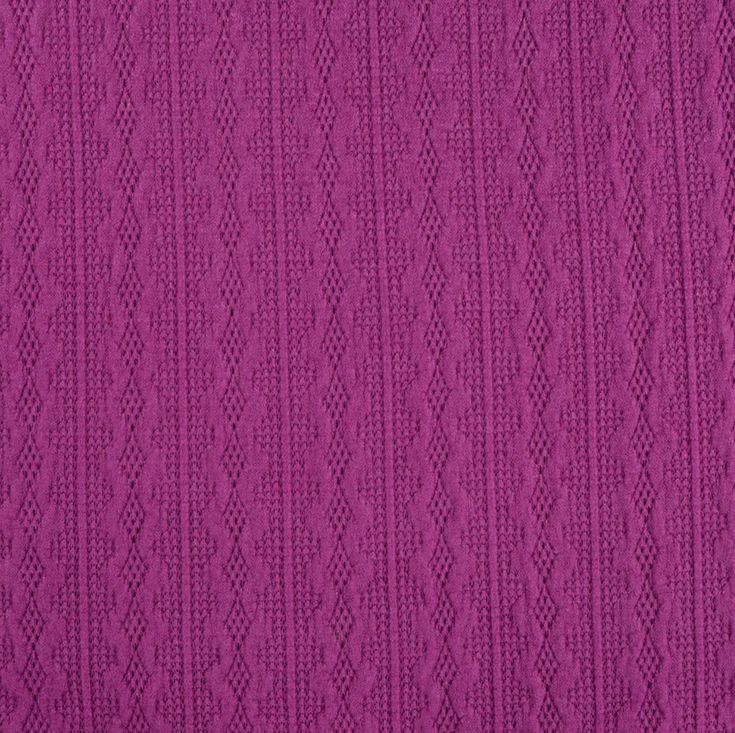 a close up view of a purple knitted fabric