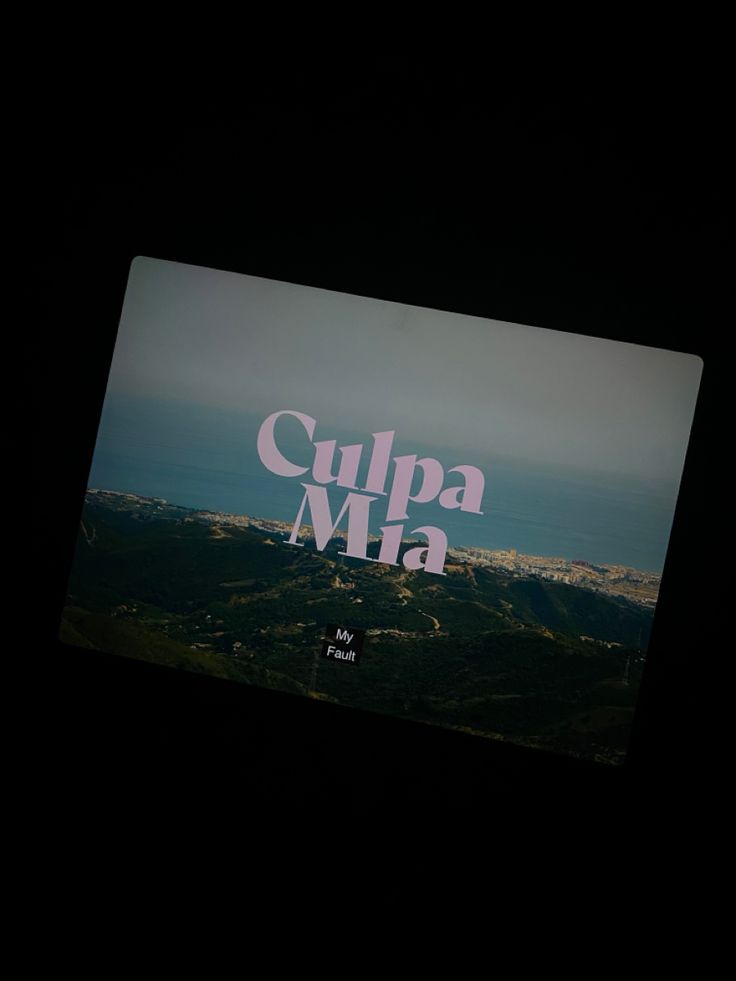 an advertisement is displayed on the back of a cell phone that reads culpa mia