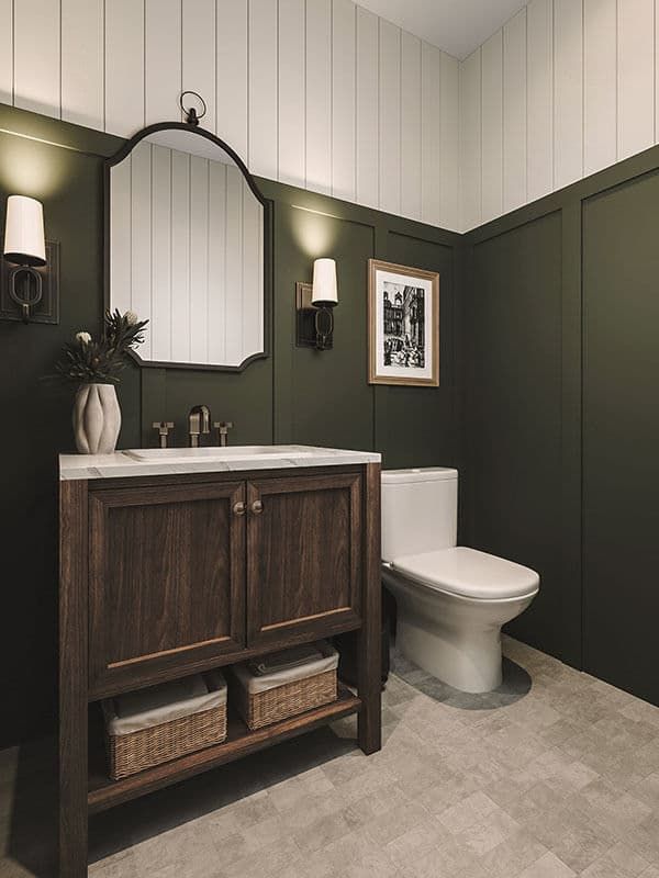 a bathroom with green walls and white tile on the floor, along with a wooden cabinet