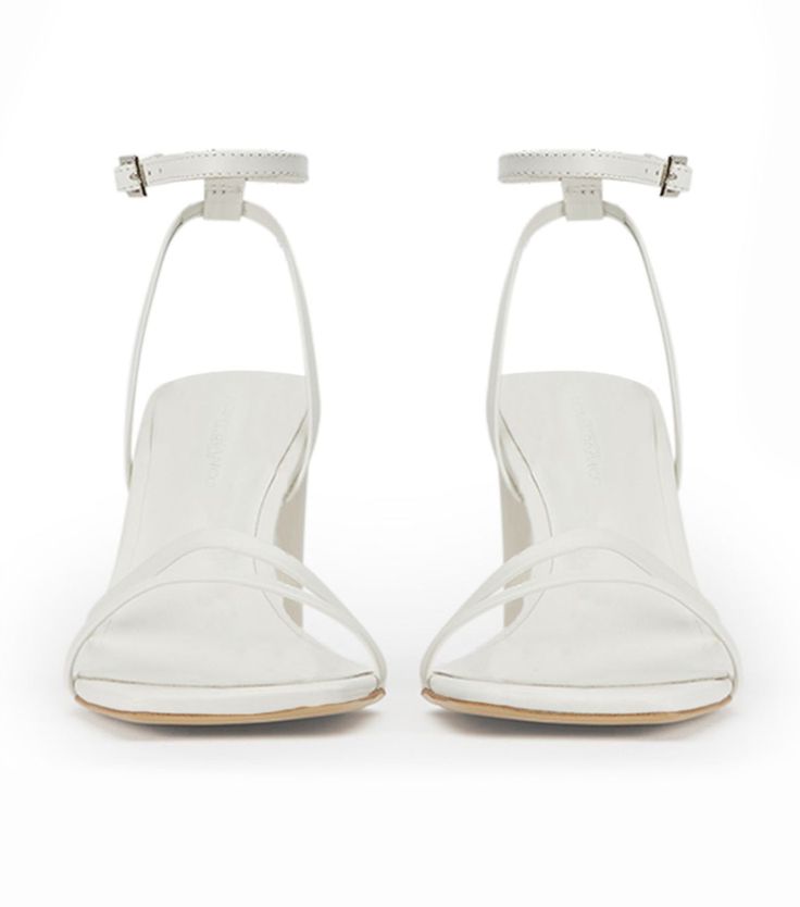 Introducing the forever classic Corso strappy heels in white leather. Designed with slender foot-framing straps, an adjustable and secure ankle strap, mid-height block heel, she remains a timeless staple. -Material: Leather Upper & Lining -Sole: Rubber -Fit: True to size -Toe-shape: Squared toe-shape -Heel: 8.5cm Classic White Sandals With Sculpted Heel, Classic White High Heel Sandals, Classic White Heels With Single Toe Strap, Formal Heels With Stacked Heel And Single Toe Strap, White Modern Block Heels With Heel Strap, Modern White Block Heels With Open Heel, Modern White Open Heel Block Heels, Classic White Sandals With Heel Strap, White Evening Sandals With Stacked Heel