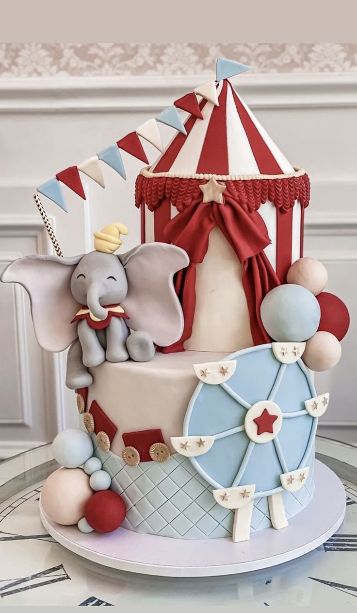 a circus themed cake with an elephant on top