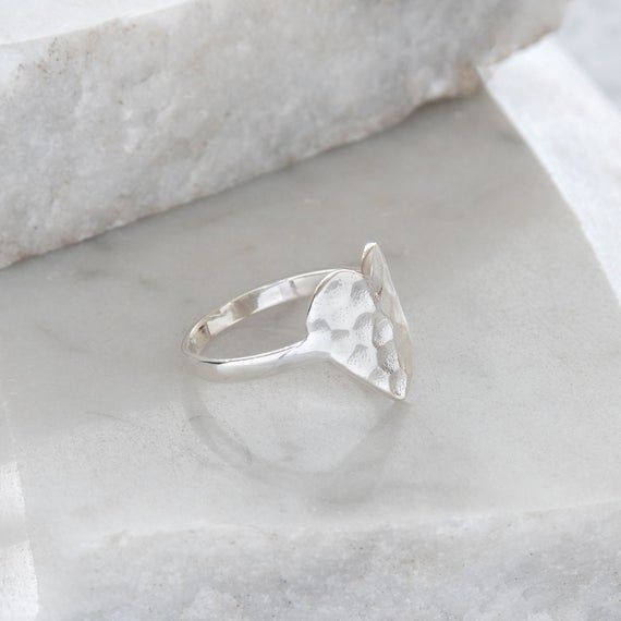 A sterling silver ring inspired by our hammered heart pendant.This piece is simple yet the most amazing statement ring and would make the perfect gift.Ring comes boxed and in 5 sizes. Below is a sizing guide using US and UK ring sizes:SMALL = USA 5, UK J/K - diameter 15.7mmSMALL/MED = USA 6, UK L/M - diameter 16.5mmMEDIUM = USA 7, UK N/O - diameter 17.3mmMED/LG = USA 8, UK P/Q - diameter 18.1mmLARGE = USA 9, UK R/S - diameter 19mmBand is made from sterling silver/925. Please rub with a silver cl Unique Locket Necklace, Unique Locket, Gold Ring Stack, Silver Lockets, Vermeil Jewelry, Charm Rings, Thumb Rings, Gift Ring, Elegant Ring