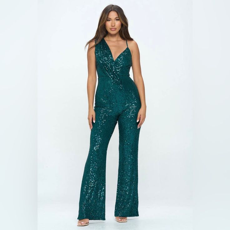 Take A Daring Leap In This Emerald Green Sleeveless Sequin Jumpsuit! With Its Sleek Design And Exquisite Detailing, This Jumpsuit Is Sure To Turn Heads At Any Special Occasion. Embrace Your Daring Side And Make A Bold Statement In This Sexy Jumpsuit. 100% Polyester Sequin Strapless Sleeveless Jumpsuit For Party, Sequin Strapless Jumpsuit For Party, Sleeveless Sequined Jumpsuit For Night Out, Sleeveless Sequined Jumpsuits And Rompers For Night Out, Sequin Sleeveless Jumpsuits And Rompers For Date Night, Sleeveless Sequin Jumpsuits And Rompers For Date Night, Glamorous Strapless Sleeveless Jumpsuit For Party Season, Fitted Sleeveless Jumpsuit For Party Season, Sequined Strapless Jumpsuit For Party Season