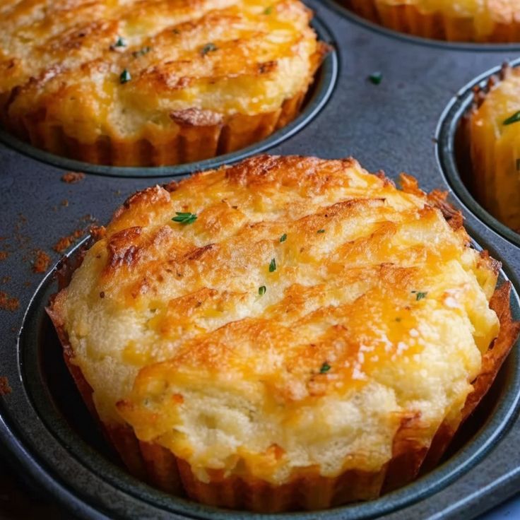 a muffin tin filled with some tasty looking food