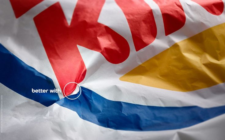 a close up view of a kfc logo on a white bag with blue, yellow and red stripes