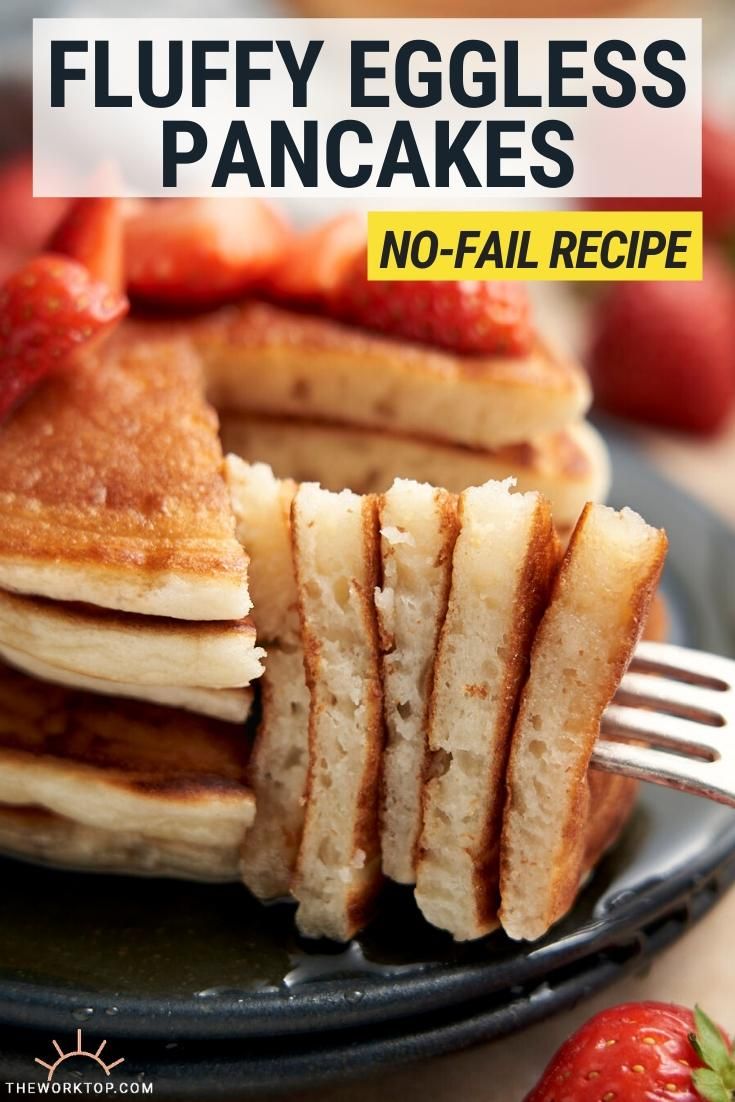 pancakes stacked on top of each other with strawberries in the background and text that reads fluffy eggless pancakes no - fail recipe