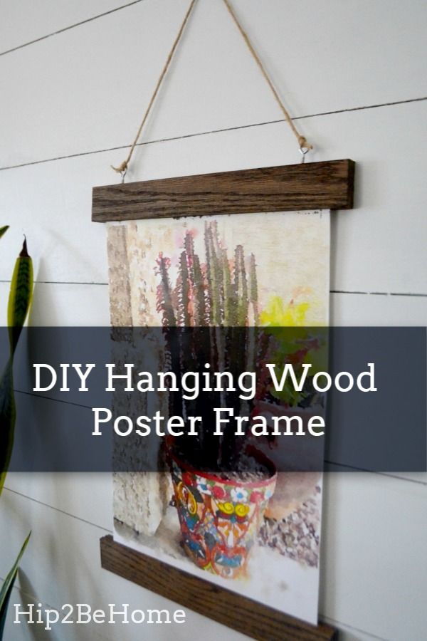 hanging wood poster frame with text overlay that reads diy hanging wood poster frame