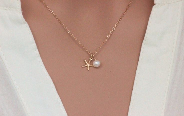 A personal favorite from my Etsy shop https://www.etsy.com/listing/249122922/gold-starfish-neckalce-14k-gold-sea Elegant Starfish Charm Jewelry For Gifts, Elegant Starfish Charm Jewelry As Gift, Elegant Starfish Charm Jewelry Gift, Summer Wedding Jewelry With Pearl Charm, Summer Wedding Pearl Charm Jewelry, Starfish-shaped Necklace With Pearl Charm For Gift, Elegant Pearl Charm Strand Jewelry, Pearl Charm Strand Jewelry Gift, Pearl Charm Strand Jewelry As Gift