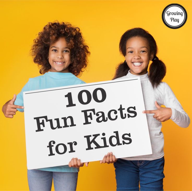 two girls holding up a sign that says 100 fun facts for kids