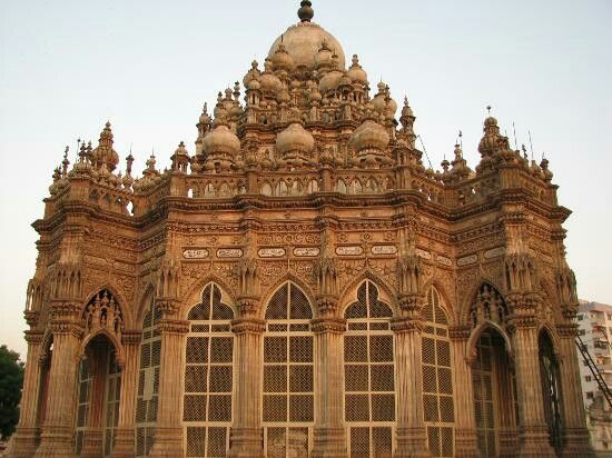 an ornate building with many windows and arches