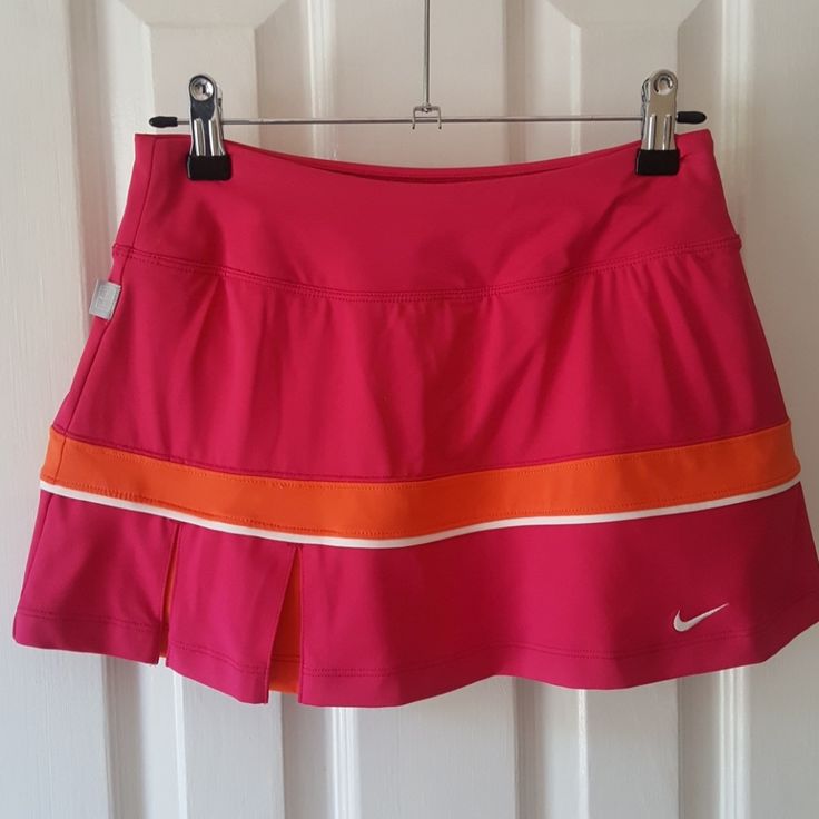 Nwot Gorgeous Fuschia And Orange Nike Dri-Fit Tennis Or Running Skirt. Built In Shorts, Pleats On Side Of Front And Back With Orange Detail Inside. Never Worn, Forgot I Had It. Sporty Pink Skirted Bottoms, Sporty Pink Mini Skirt For Sports, Pink Mini Skirt For Sports In Spring, Pink Sports Skirt With Lining, Pink Lined Sports Skirt, Pink Sporty Skirted Skort, Fitted Nike Skirt, Sporty Pink Mini Skirt For Summer, Nike Sports Skirt For Spring