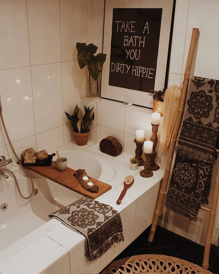 a bathroom with a bathtub and candles on the counter