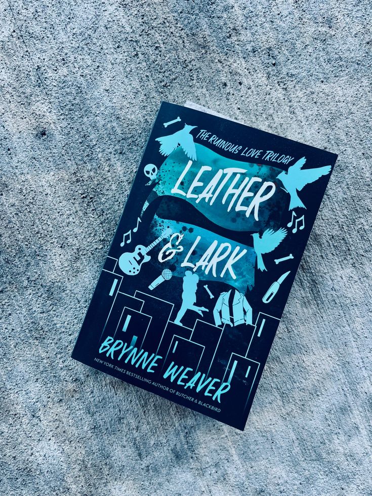 a book sitting on top of a cement floor