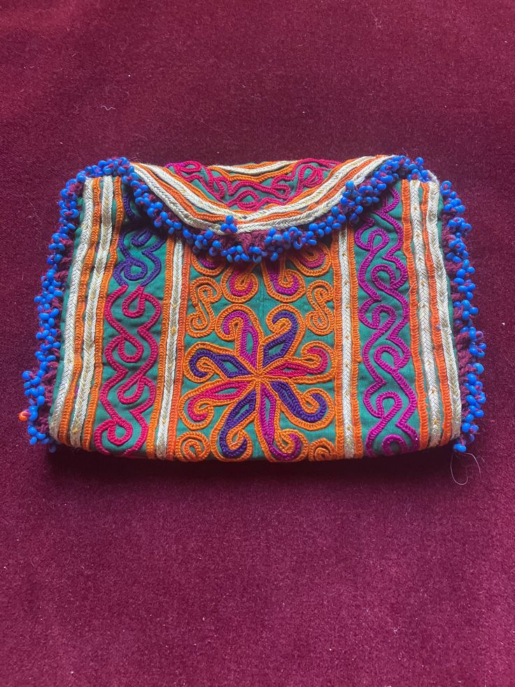 Embroidered afghan wallet - I added a big snap so it closes nicely . Made for the tourist market in 1970s  By 1980 the Russians were there and this business was over I think these are hand made work but maybe hand work with a machine that isn't an automatic computer one Bohemian Clutch Pouch For Daily Use, Blue Bohemian Rectangular Pouch, Bohemian Multicolor Rectangular Pouch, Bohemian Clutch With Handwork, Bohemian Multicolor Travel Pouch, Bohemian Clutch Shoulder Bag For Festivals, Bohemian Embroidered Rectangular Clutch, Bohemian Rectangular Clutch For Festival, Handmade Pouch Clutch For Festivals