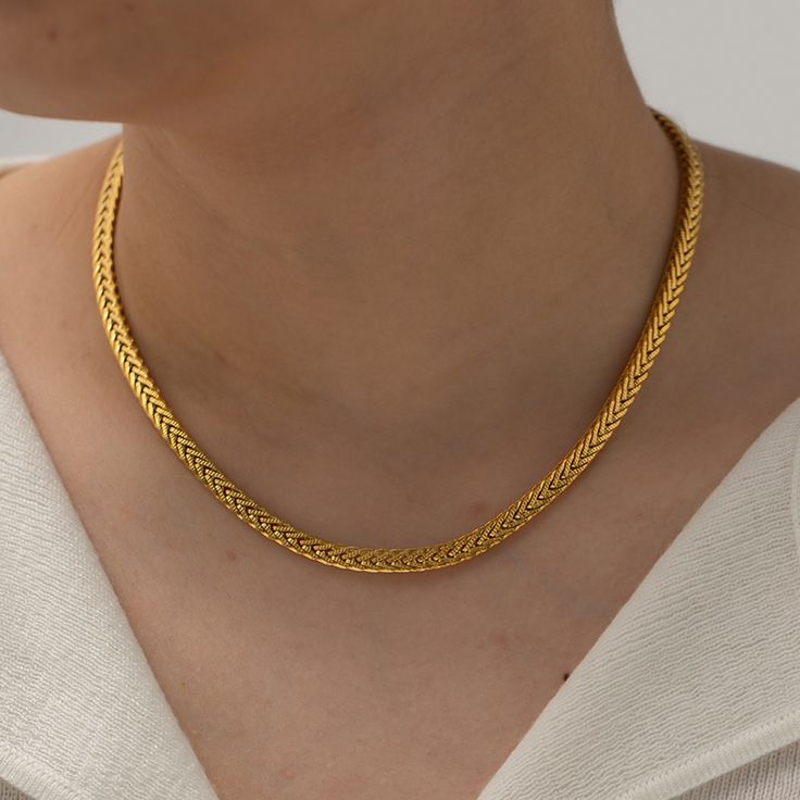 Step up your accessory game with the Francesca Gold Necklace. Crafted from high-quality titanium steel and finished with an 18k gold coating, this piece brings a touch of elegance and durability to your collection. The Franco chain design adds a unique, textured look that pairs well with both casual and formal outfits. Whether you’re dressing up for a night out or adding a chic detail to your everyday ensemble, this necklace is a versatile must-have Franco chain 16" + 2" extension. Non-fading, w Minimalist Yellow Gold Stainless Steel Chain Necklace, Yellow Gold Stainless Steel Chain Necklace, Minimalist Gold Stainless Steel Chain Necklace, Modern Yellow Gold Stainless Steel Chain Necklace, Elegant Stainless Steel Wheat Chain Necklace, Gold Plated Wheat Chain Necklace For Formal Occasions, Yellow Gold Stainless Steel Box Chain Necklace, Yellow Gold Stainless Steel Snake Chain Jewelry, Formal Gold-plated Wheat Chain Necklace