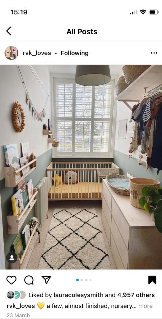 a baby's room with a crib in the corner