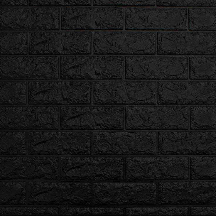 a black brick wall that is very dark