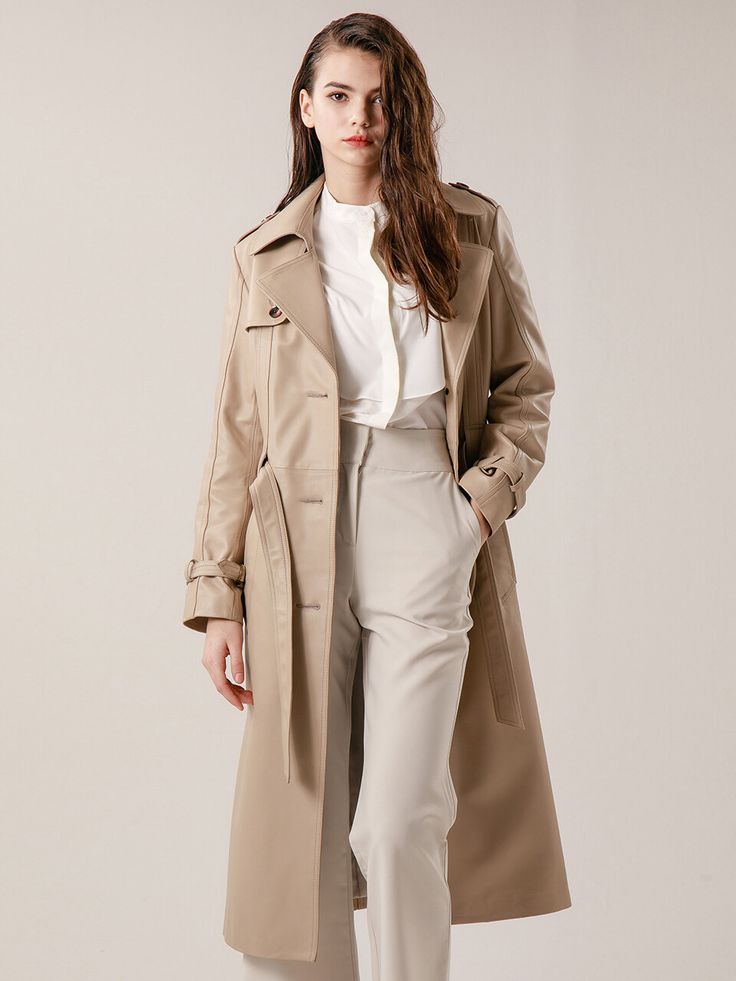 Editor's Notes This simple trench coat made with lambskin has long classic natural look expressing  both formal and casual mood. The belt at waist line can be tightened to create slender silhouette as well. Have this lambskin trench coat creating unique chic mood perfect for sophisticated outfit.- Brand's signature wide convertible notch collar- Polyester lining with soft touch- Top stitching detail with original mood- Adjustable belt- Real horn buttons used- Premium lamb skin with sof Beige Belted Outerwear For Business Casual, Elegant Cream Leather Outerwear, Classic Beige Belted Outerwear, Midsize Outfits, Long Trench, Long Trench Coat, Notch Collar, Adjustable Belt, Natural Look