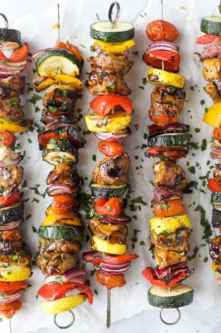 several skewers filled with different types of vegetables