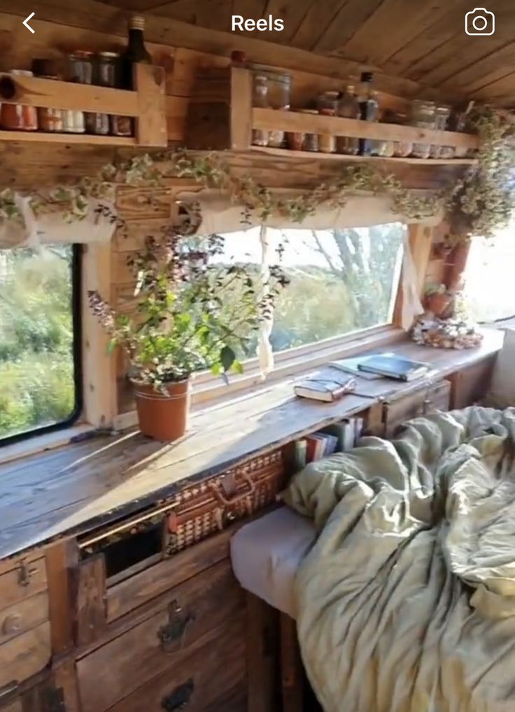 a bed sitting in the middle of a bedroom next to a wooden desk and window