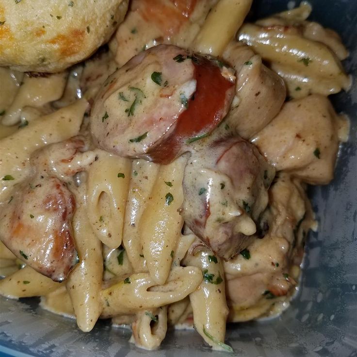 pasta with meat and cheese in a blue bowl