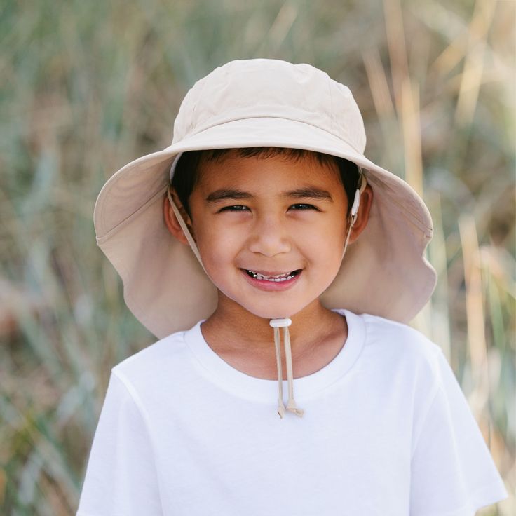 With a wide brim and generous neck flap, this hat provides the best in breathable sun protection!    Gro-With-Me®: Fully adjustable head drawstring and chinstrap  50+ UPF: No harmful chemicals, dyes or solutions added  100% COTTON: Breathable and comfortable  STAYS ON: In windy conditions or when child pulls  SAFE: Break-away safety clip on chinstrap   Back to Cotton Adventure Hats | See more Kids Sun Hats Outdoor Solid Bucket Hat With Upf 50+, Solid Bucket Hat With Upf 50+ For Outdoor, Outdoor Sun Hat With Upf 50+, Outdoor Sun Hat With Upf 50+ Protection, Outdoor Solid Color Sun Hat With Upf 50+, Upf 50+ Sun Hat For Outdoor Use, Upf 50+ Solid Color Sun Hat For Outdoor, Travel Sun Hat With Adjustable Fit, Adjustable Solid Bucket Hat For Summer