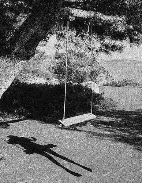 an old black and white photo of a person swinging on a rope swing with the caption you walk in your backyard and see this what's your next move????