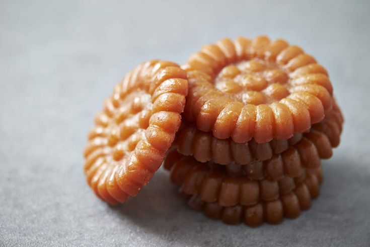 three pieces of food are stacked on top of each other in the shape of spirals