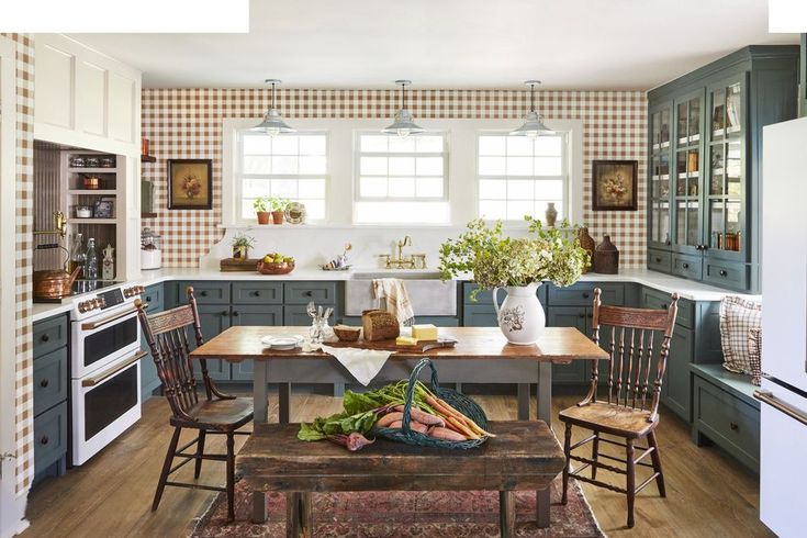 a kitchen filled with lots of furniture and decor