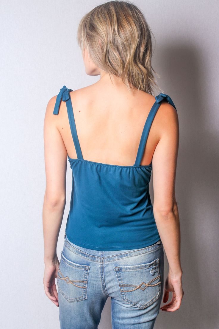 Package Price : $28.00Price Per Unit : $3.50Fabrication : 96% Polyester & 4% SpandexColor : TealMade in : MEXICOSize Ratio : XS-S-M-L / 2-3-2-1Package : 8 Per PackCare Instruction:- Hand Wash With Cold Water - Do Not Bleach- Lay Flat to Dry* Model is wearing : Medium* Model's Height : 5'7 (170 cm) Fitted Elastane Summer Tops, Fitted Elastane Tops For Summer, Fitted Tie Back Top, Trendy Stretch Tank Top With Tie Back, Trendy Stretch Tops With Tie Back, Elastane Stretch Tops For Day Out, Trendy Cotton Tie-back Top, Trendy Cotton Tie Back Top, Seamless Stretch Tops For A Day Out