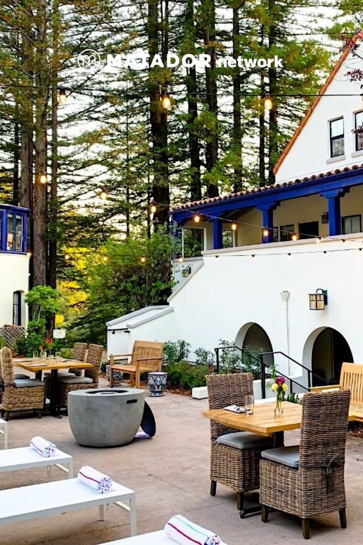 an outdoor dining area with tables and chairs