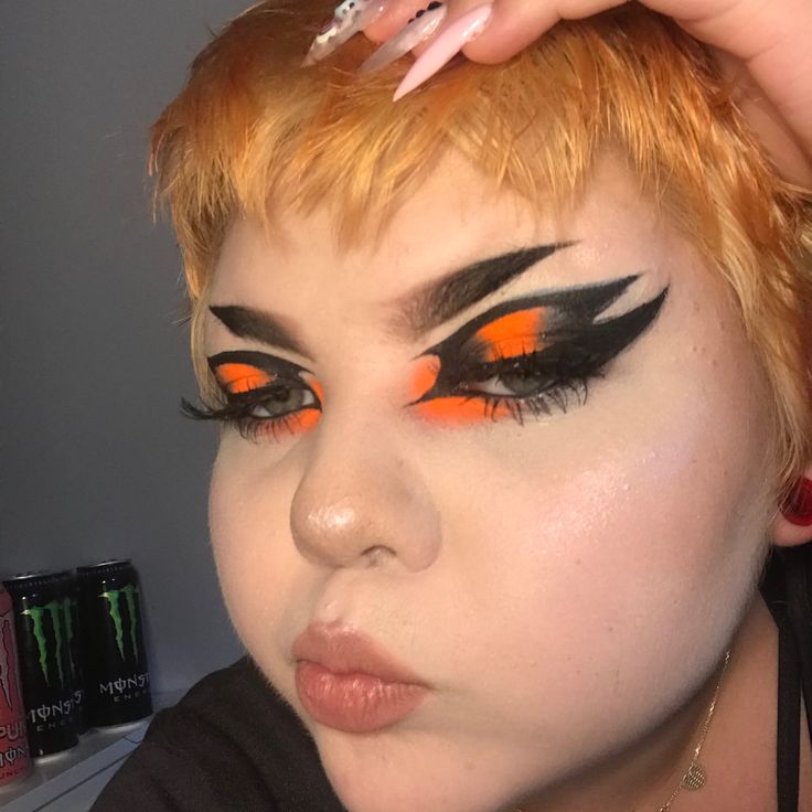 Crazy Eyeliner Goth, Orange And Black Clown Makeup, Orange Grunge Makeup, Neon Goth Makeup, Orange Goth Makeup, Dramatic Eyeliner Goth, Orange And Black Makeup Looks, Orange Black Makeup, Black And Orange Makeup