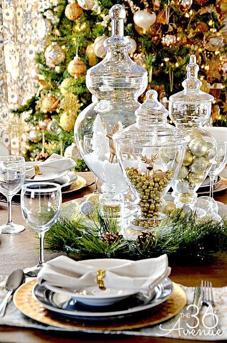 a christmas table setting with plates and silverware