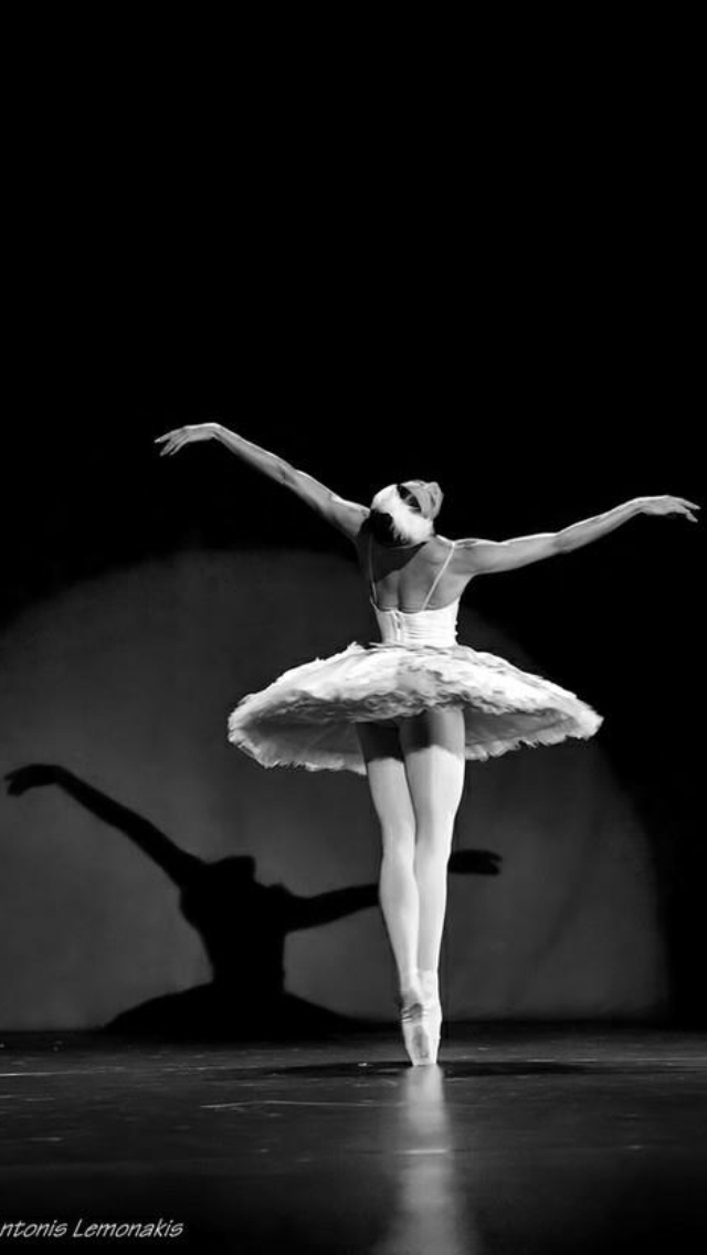 a black and white photo of a ballerina