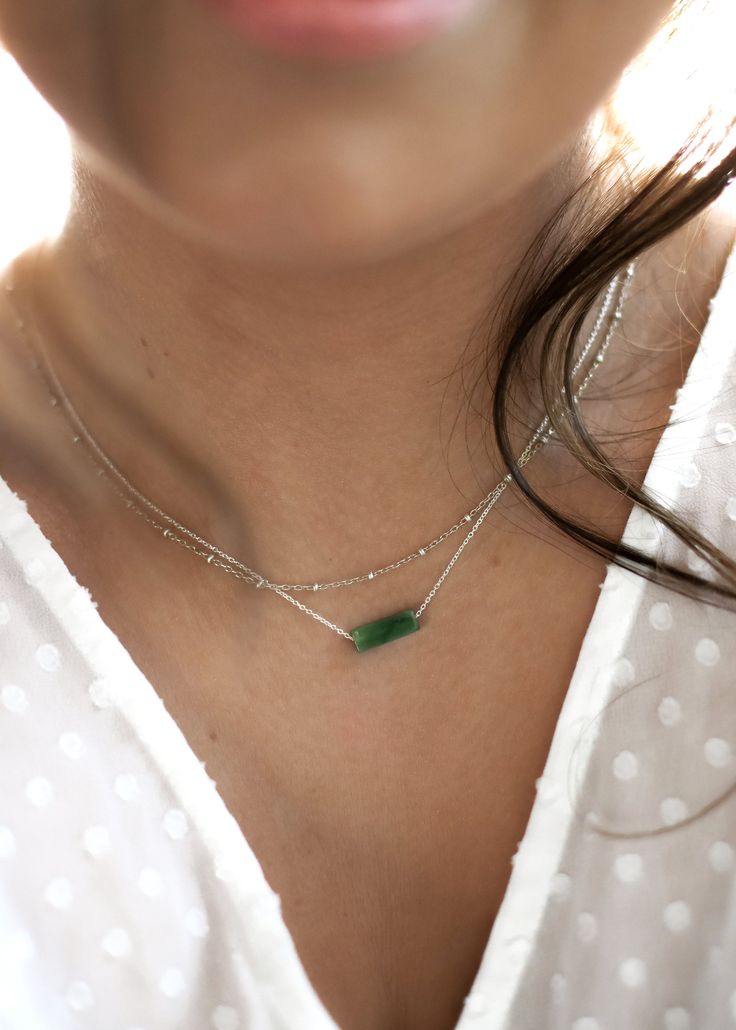 "Highlights * Made With 14k Yellow Gold Filled or Sterling Silver Pieces * Features a 13mm (About 1/2\") Genuine Jade Pendant * Available In 14\", 16\", 18\", 20\", 22\" Lengths About This Piece Our dainty jade necklaces are a great way to carry your most special moments with you! These simple and minimal necklaces are made to suit anyone and will last a lifetime. Our gemstones and their colors are authentic; they are not dyed or altered!" Green Jewelry With Delicate Chain For Layering, Minimalist Jade Jewelry For May Birthstone, Minimalist Jade Jewelry, Coordinates Bracelet, Stamped Necklaces, Amazonite Necklace, Bar Pendant Necklace, Minimal Necklace, Jade Necklace