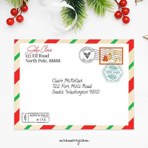 a red and green christmas postcard with an envelope