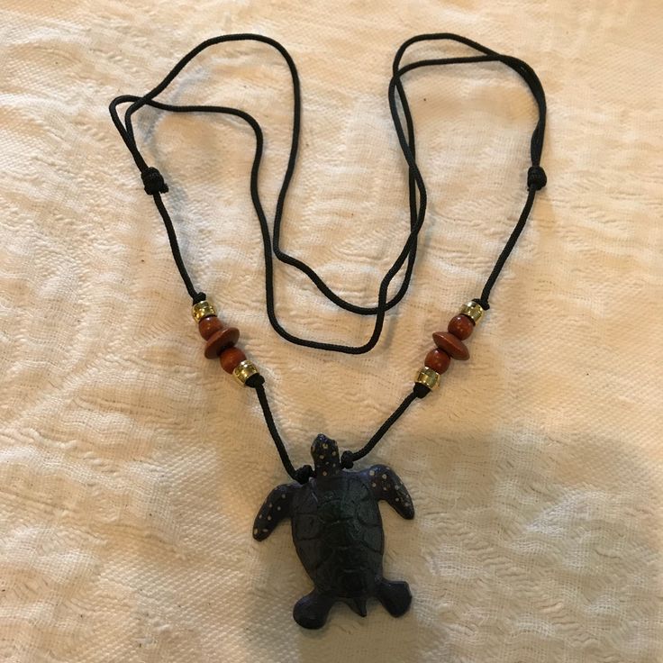 Pretty Adjustable Turtle Necklace. The Turtle Is Black And Made Of Wood. Measures 17 Inches. Nwot Black Casual Necklace With Adjustable Cord, Casual Black Necklace With Adjustable Cord, Casual Black Pendant Jewelry, Casual Black Necklace For Gift, Black Beach Jewelry With Adjustable Cord, Handmade Black Necklace For The Beach, Handmade Black Necklace For Beach, Turtle Necklace, Made Of Wood