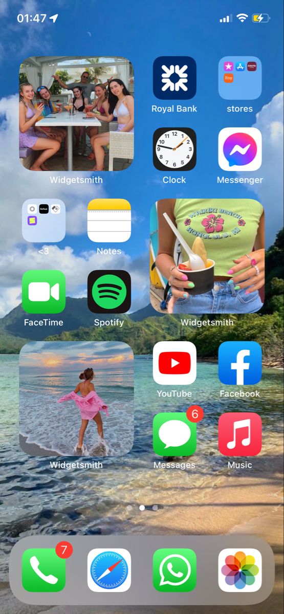 an iphone screen with several different icons and images on the phone, including people in the background