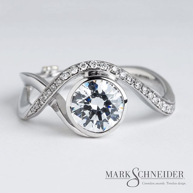 a white gold diamond ring with diamonds on it