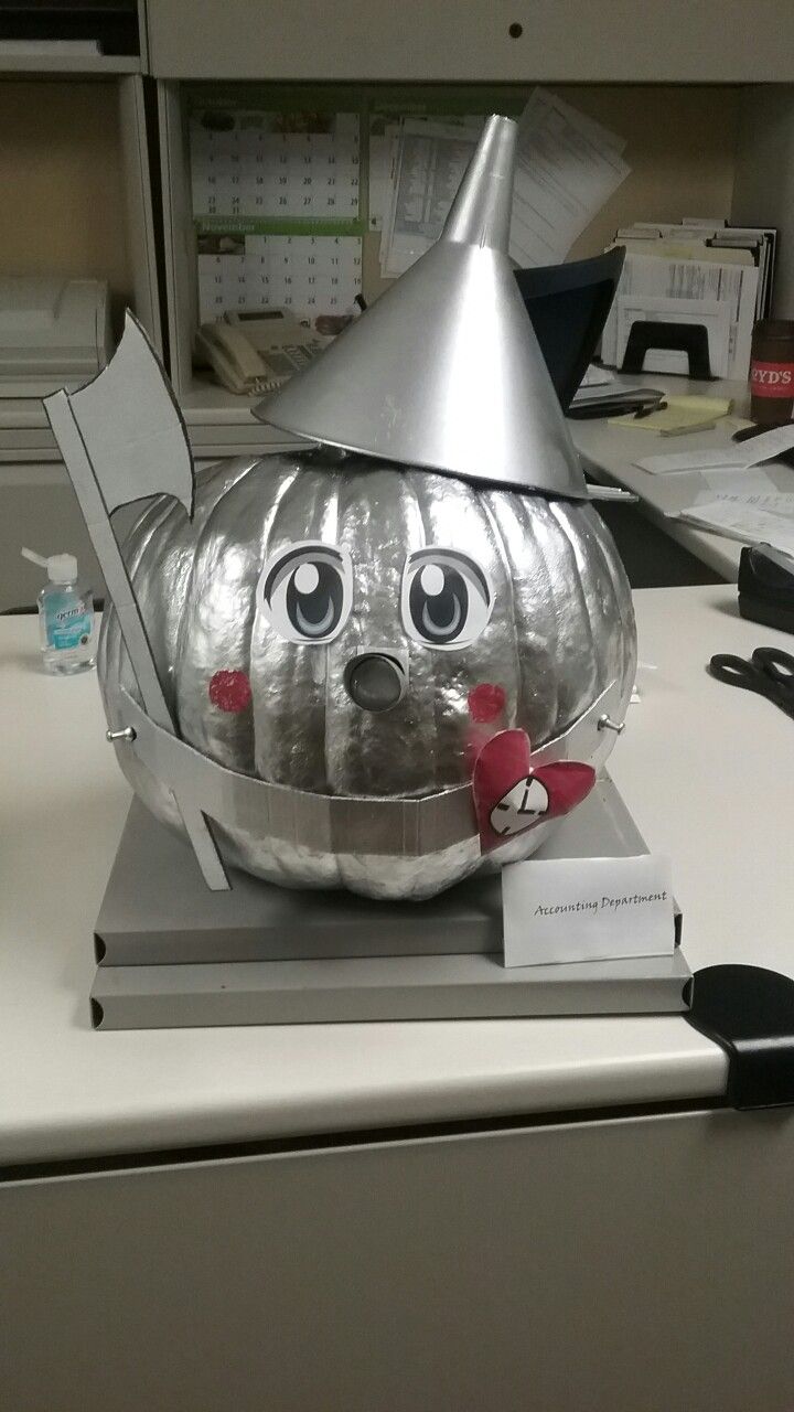 a metal pumpkin sitting on top of a desk