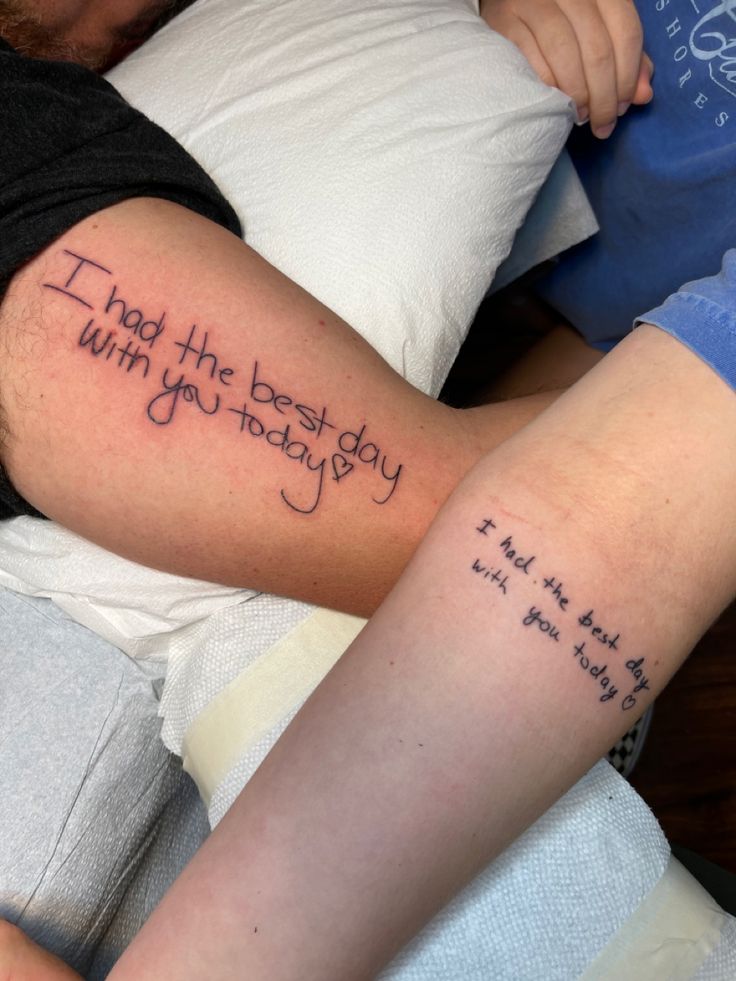 two people with tattoos on their arms that say i may the best day be with you today