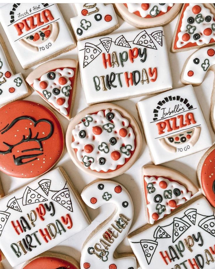 many decorated cookies with happy birthday written on them are arranged in the shape of pizzas