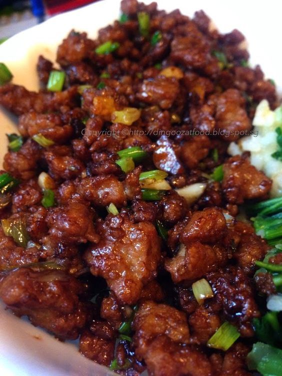 a white plate topped with meat and broccoli